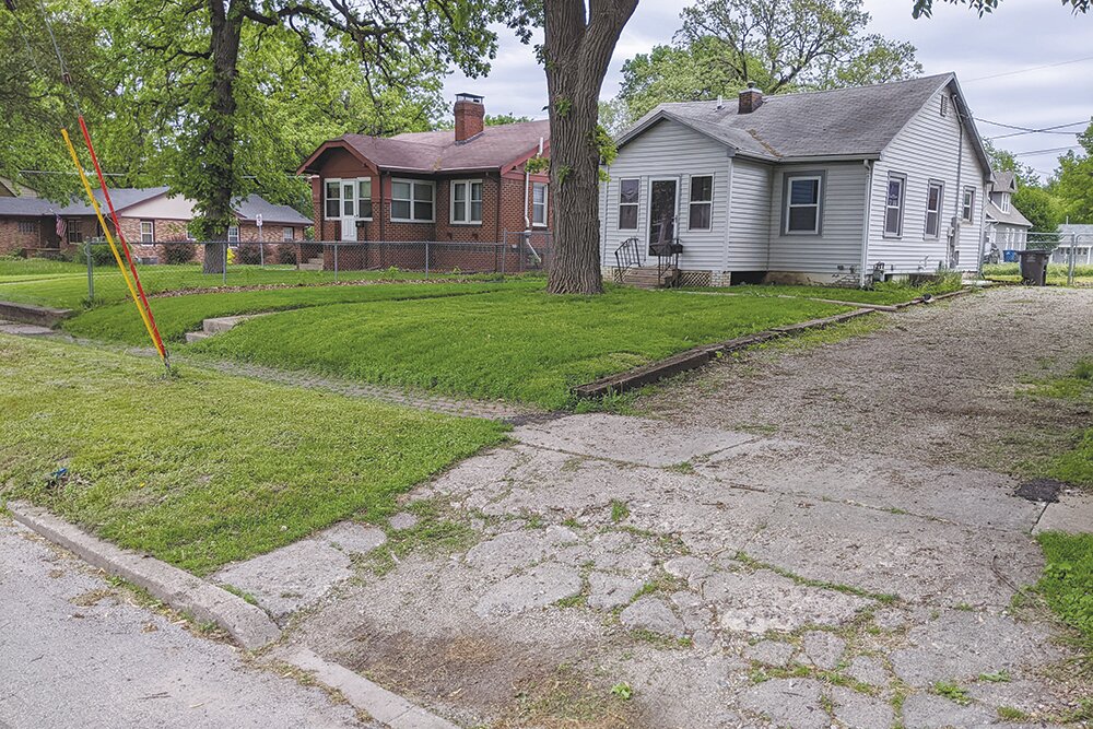 A before photo shows driveway repairs reimbursed in part by Invest DSM, Des Moines, Iowa's neighborhood block grant program. This program was the inspiration for Restore SGF.